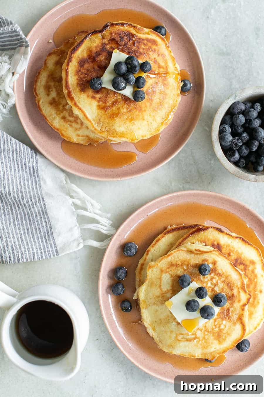Your Ultimate Easter Recipe Collection 14 Stack of fluffy pancakes with butter and syrup, a classic for Easter breakfast.