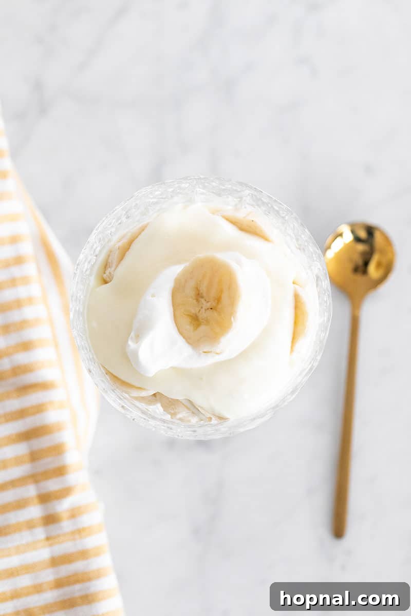 Your Ultimate Easter Recipe Collection 20 Classic banana pudding with fluffy whipped cream and fresh banana slices, an ideal Easter dessert.