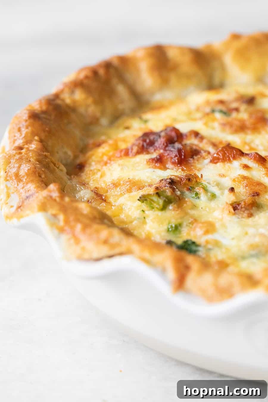 Your Ultimate Easter Recipe Collection 3 Homemade chorizo quiche with a buttery, flaky pie crust, ideal for an Easter meal.