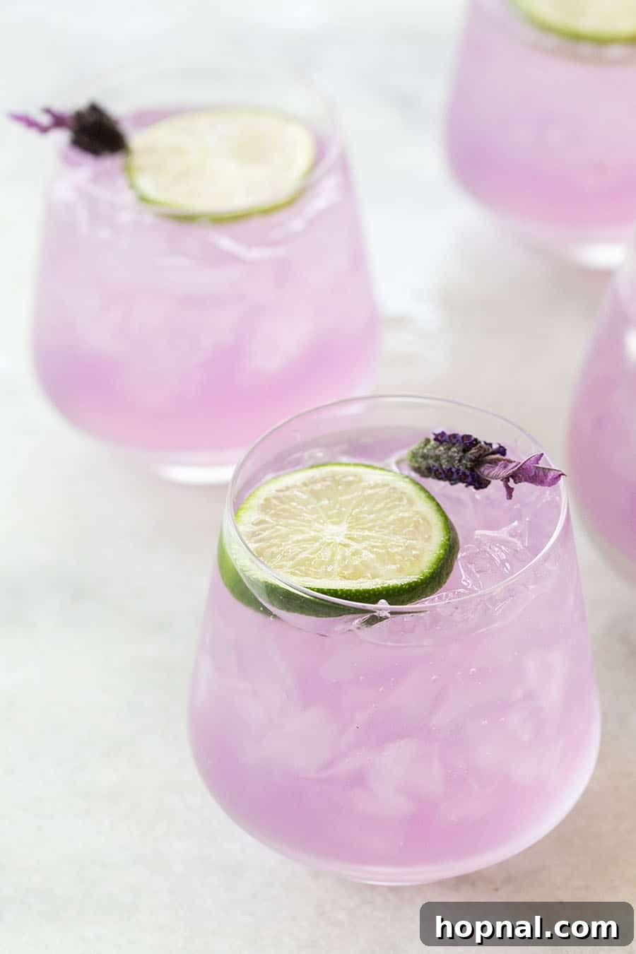Your Ultimate Easter Recipe Collection 25 Beautiful purple lavender gin and tonic, a light and refreshing spring cocktail.