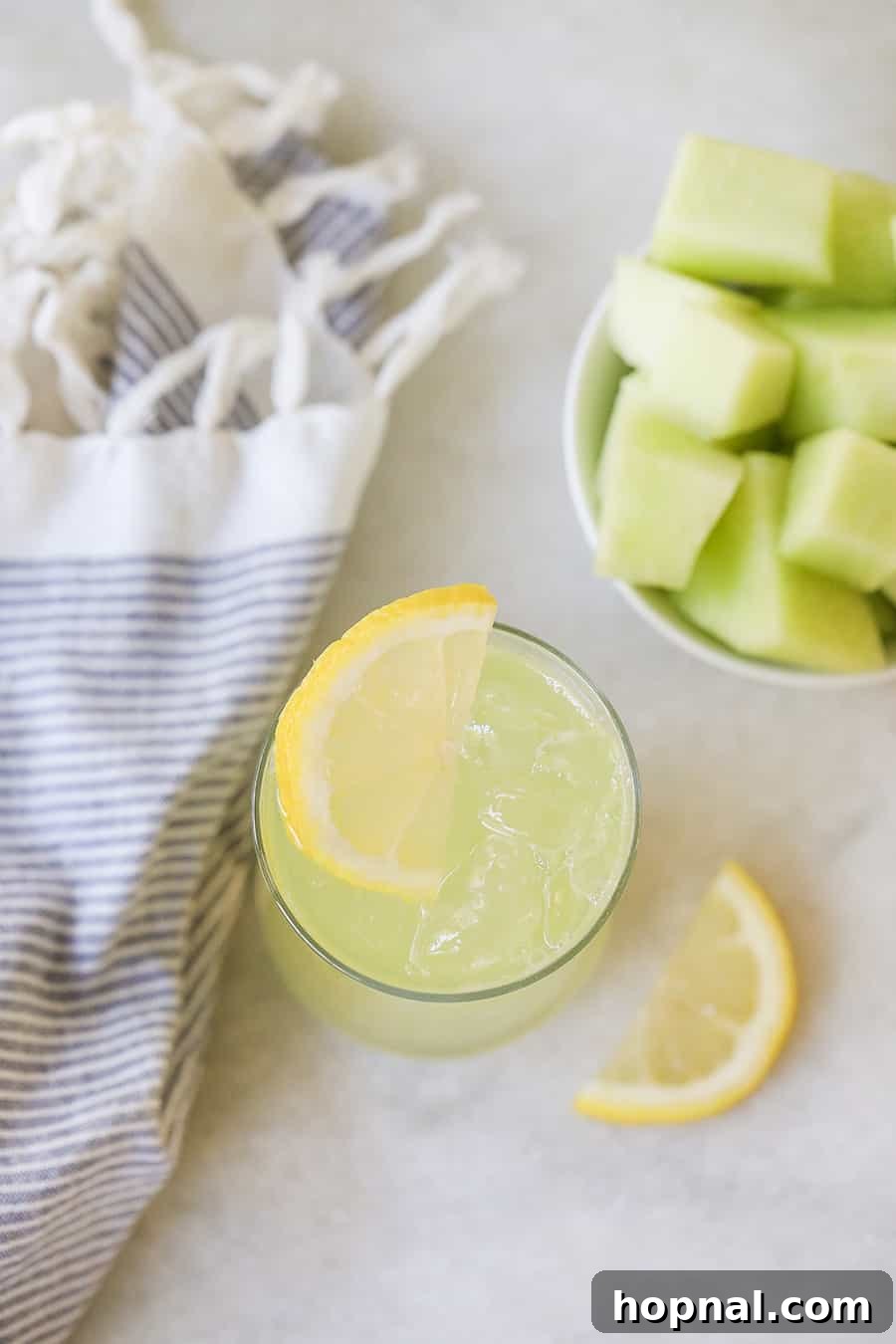 Your Ultimate Easter Recipe Collection 28 A refreshing glass of honeydew lemonade with ice and garnish, perfect for spring and summer.