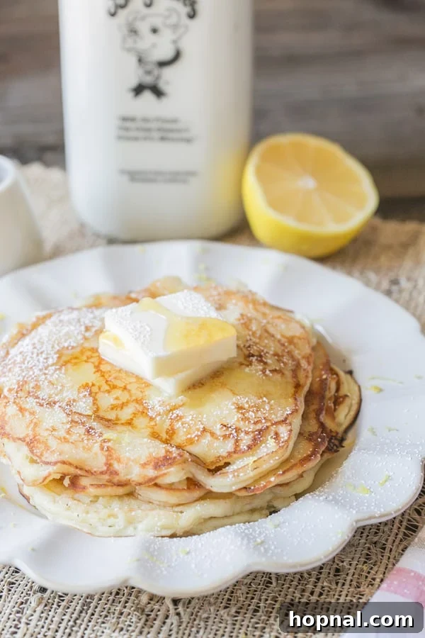 Your Ultimate Easter Recipe Collection 6 Fluffy lemon ricotta pancakes topped with fresh berries, perfect for an Easter breakfast or brunch.