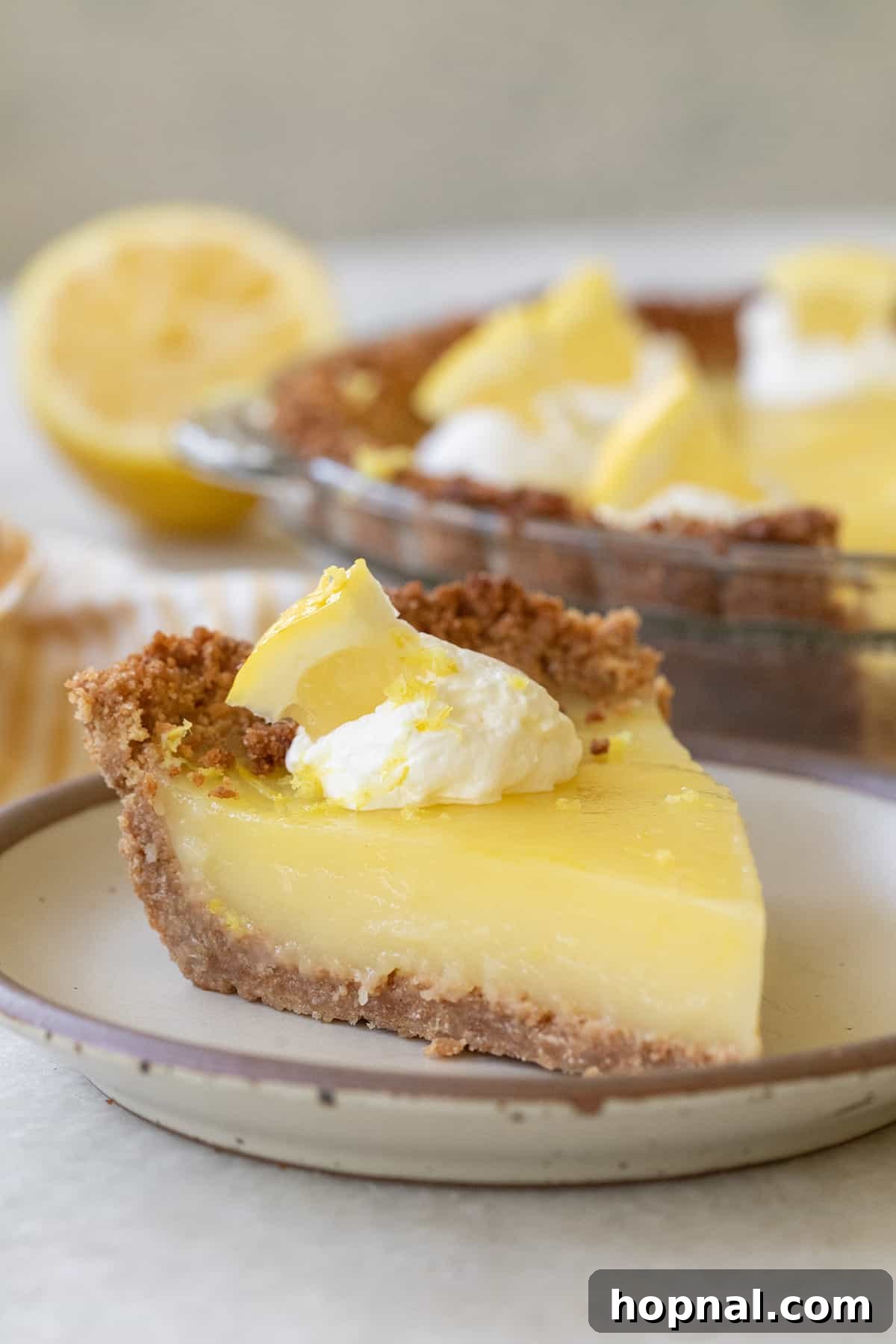 A perfect slice of the best real lemon pie, showcasing its smooth, creamy filling and delicate crust.