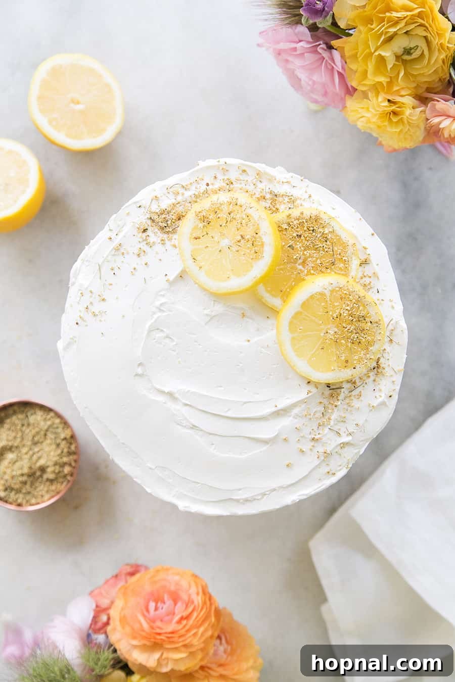 An elegant slice of elderflower cake, showcasing its delicate layers and sophisticated presentation.