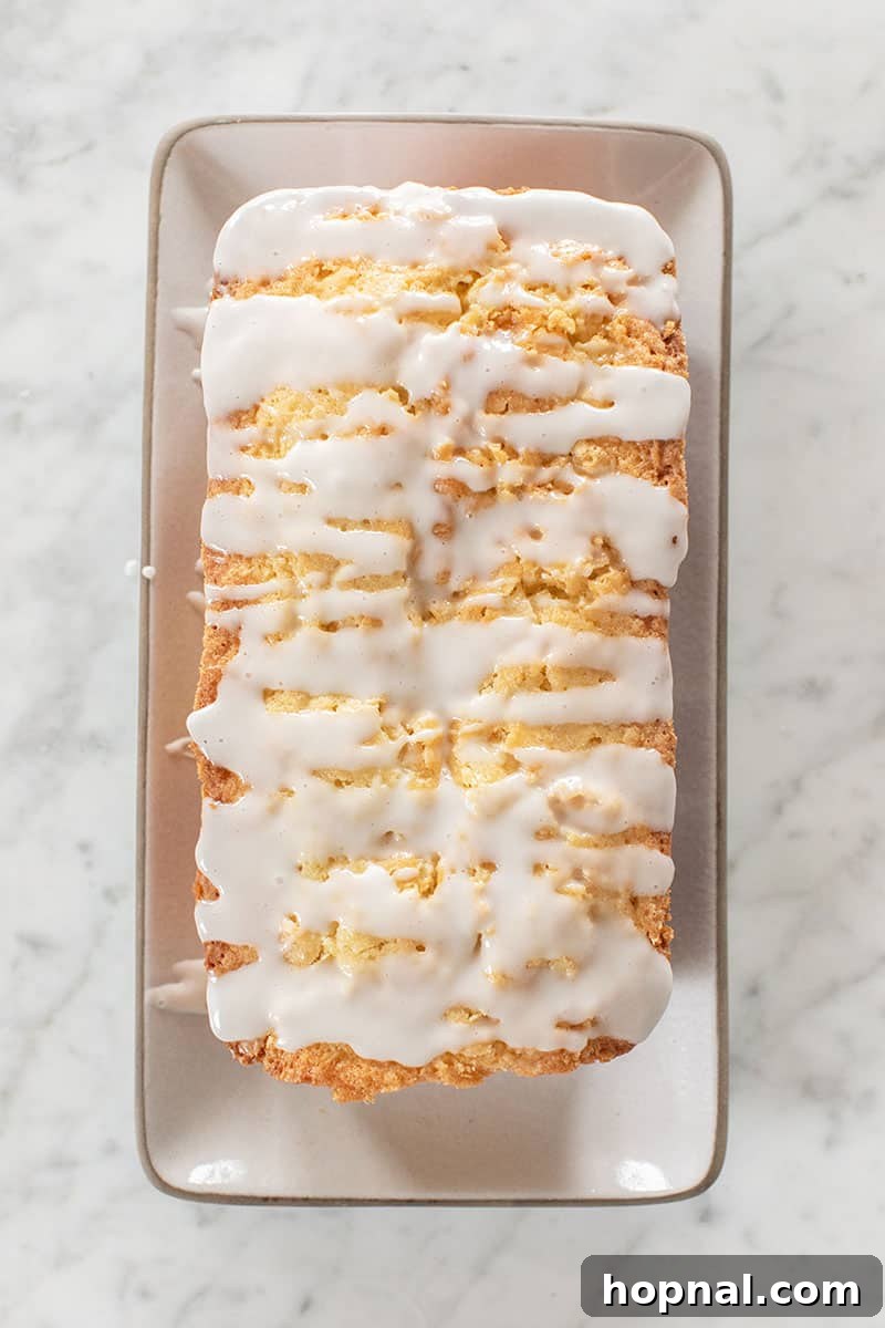 A delicious coconut loaf cake, beautifully sliced and ready to be enjoyed.