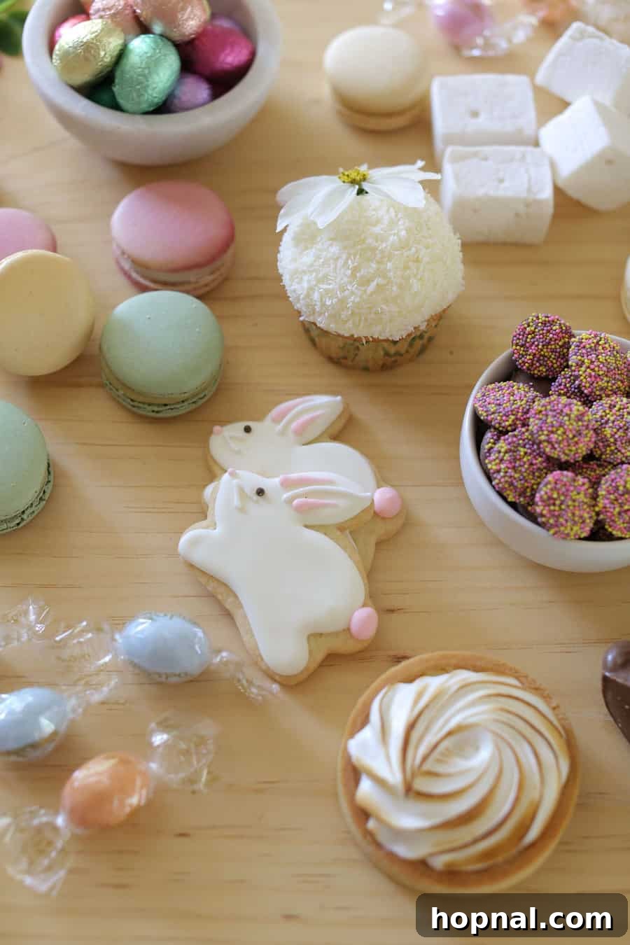 A vibrant display of Easter candies, delicate cookies, and colorful macarons, perfect for a festive spring gathering.