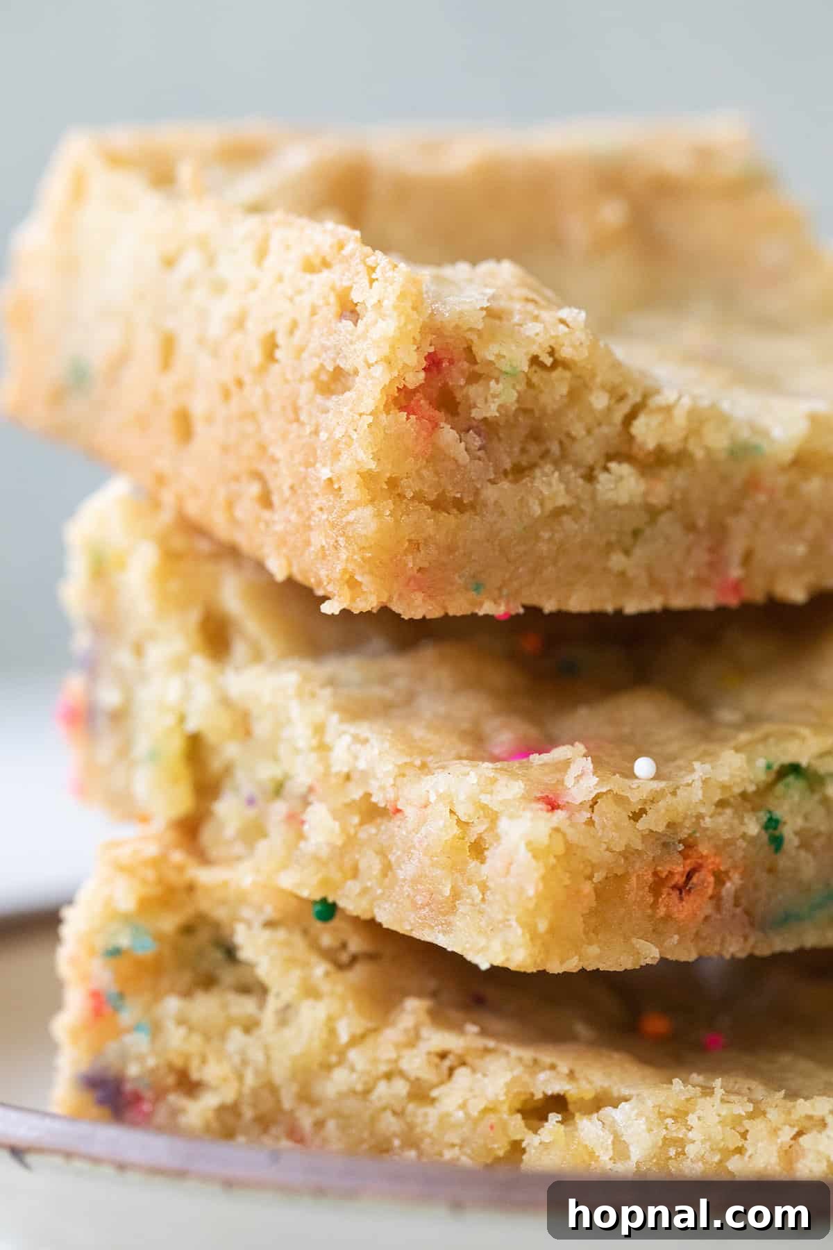 Stacks of chewy vanilla blondies, perfectly golden and ready to be enjoyed.