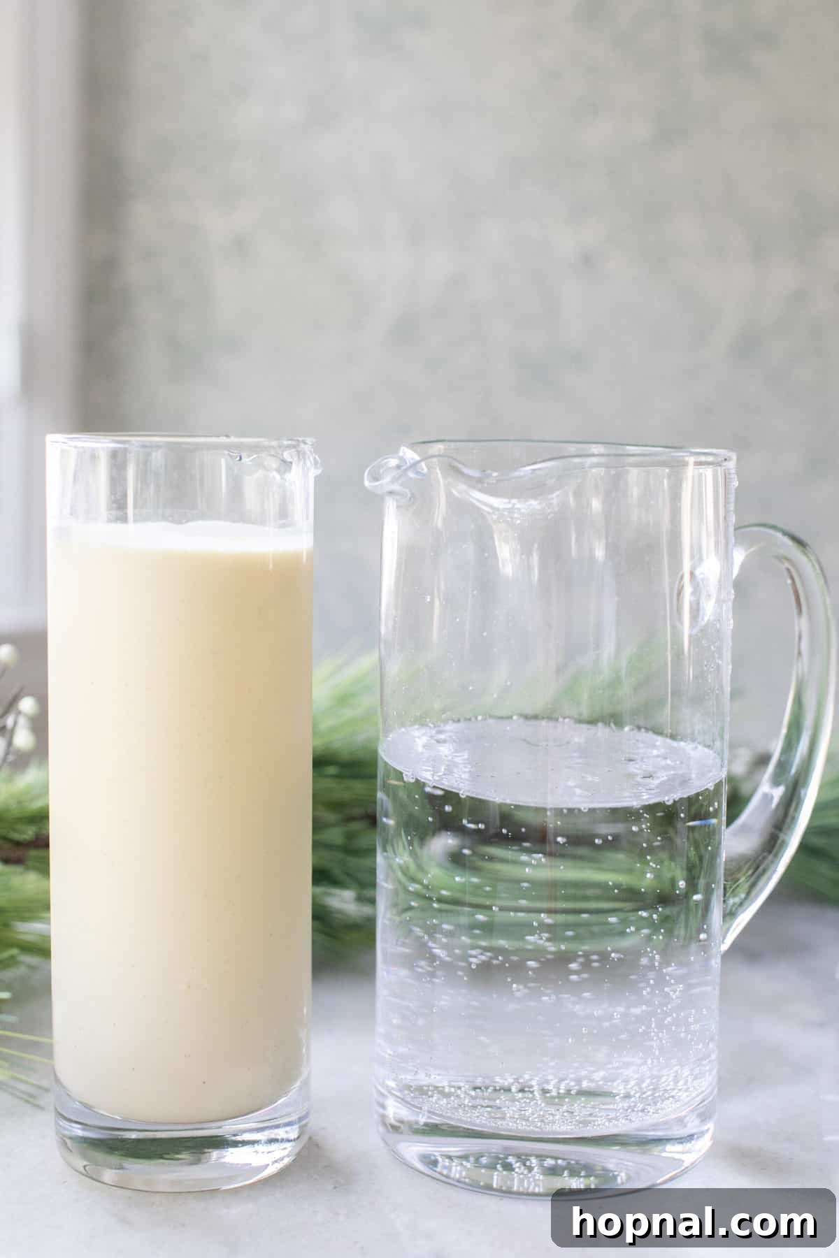 Frosted Peppermint Punch 3 Eggnog and club soda in large glass jars, ready to be mixed for the punch.