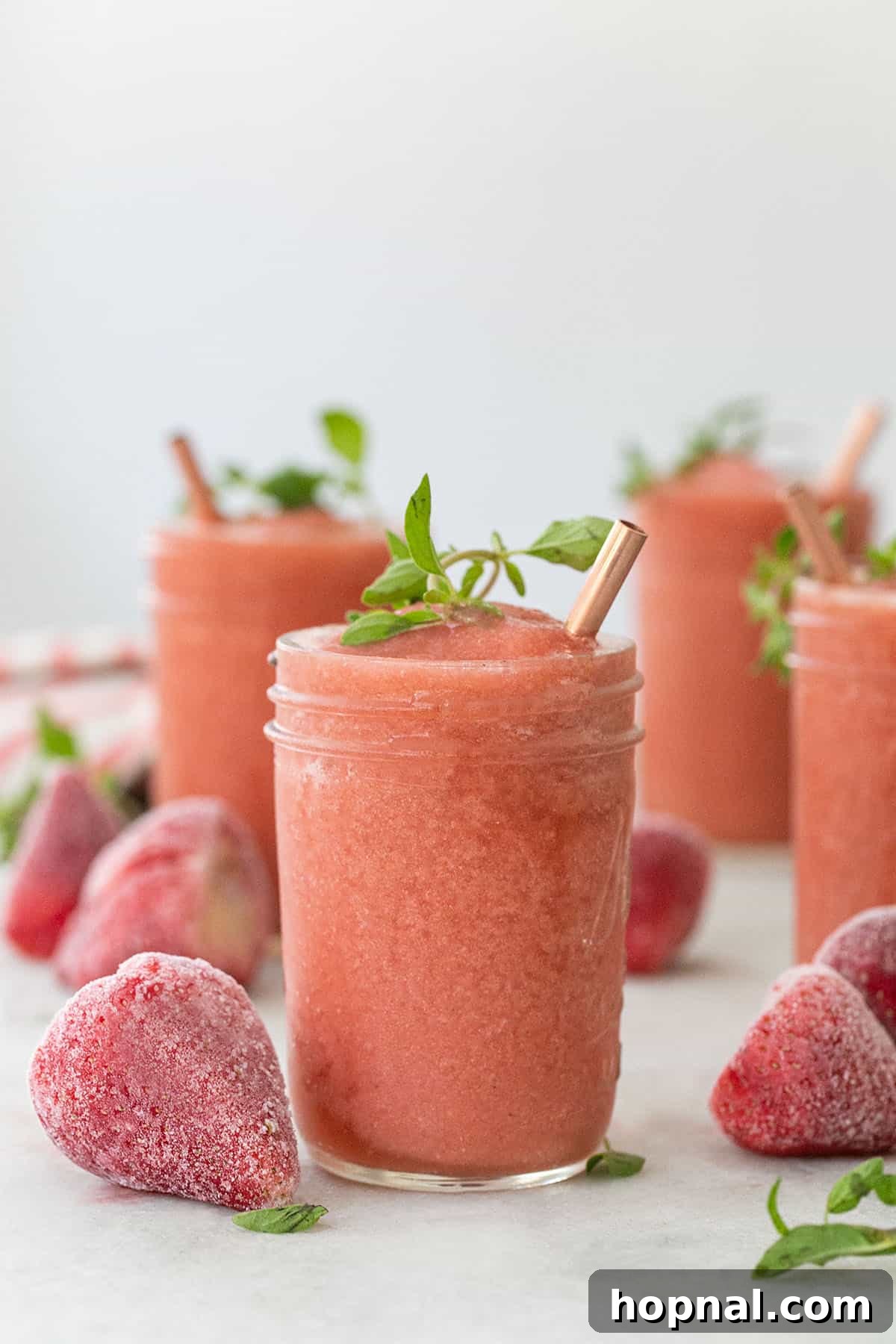 Frozen Strawberry Frosé cocktail in a wine glass.