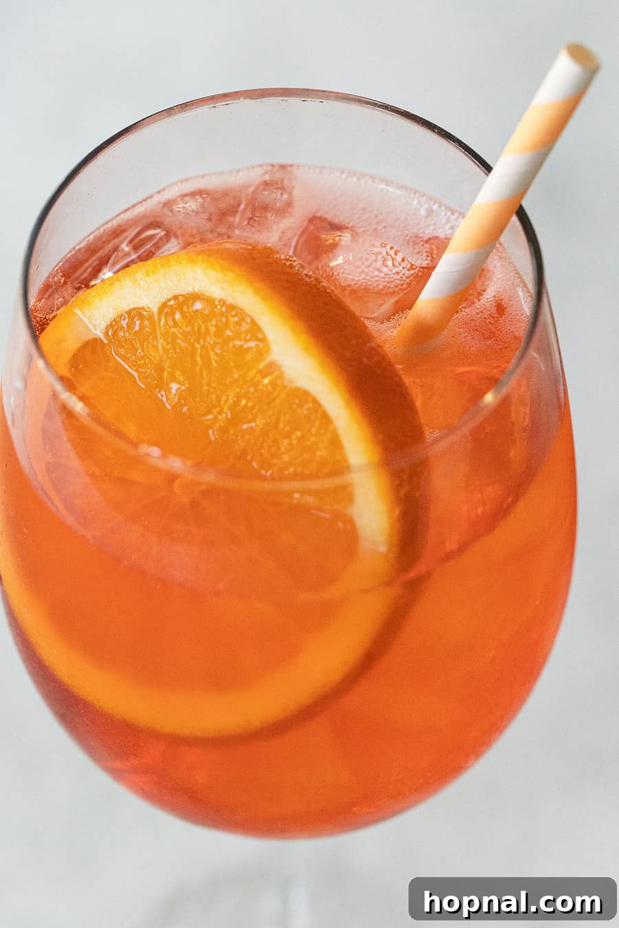 Easy summer cocktail Aperol Spritz in a classic wine glass.