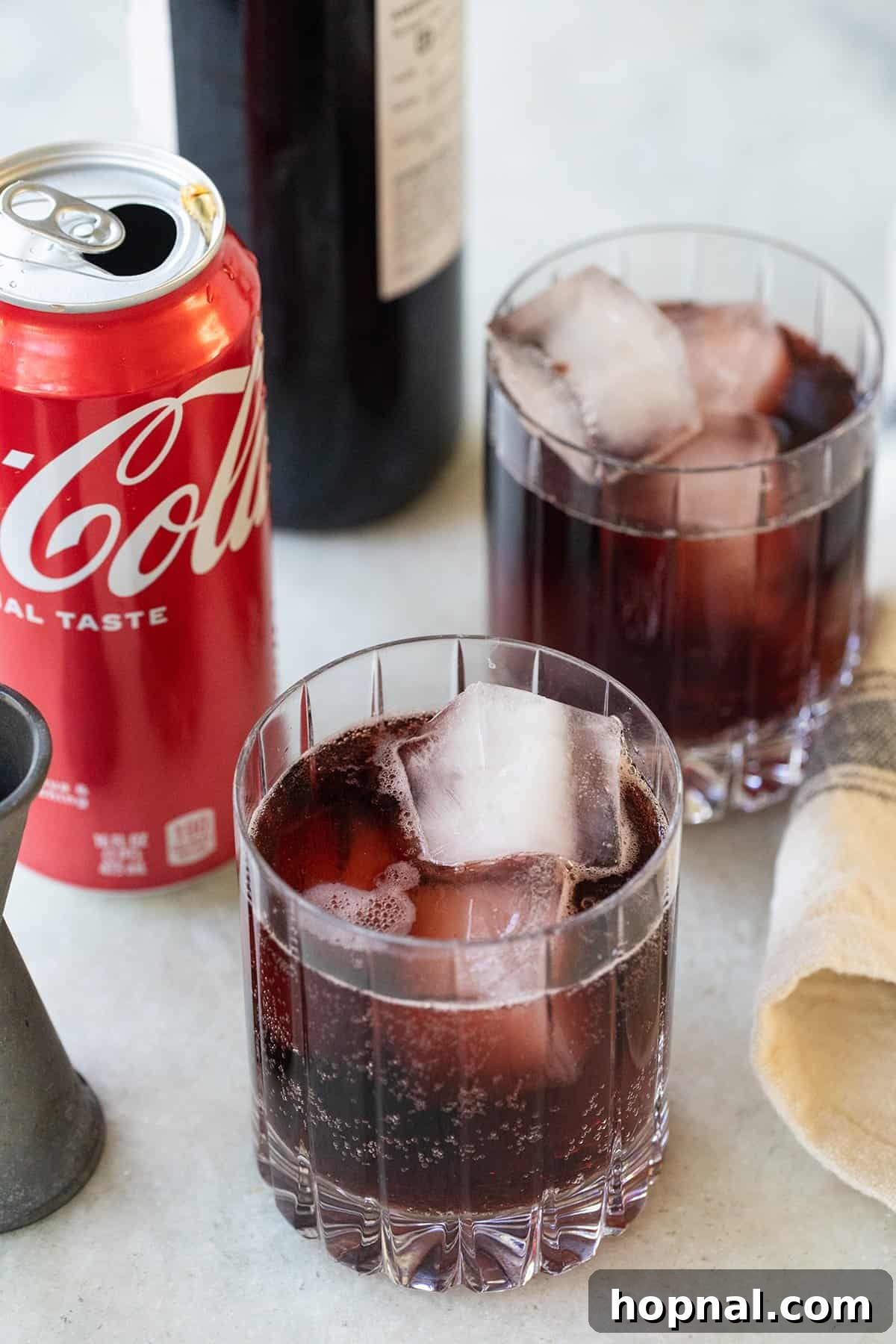 Kalimotxo, red wine and coke in a glass with ice.
