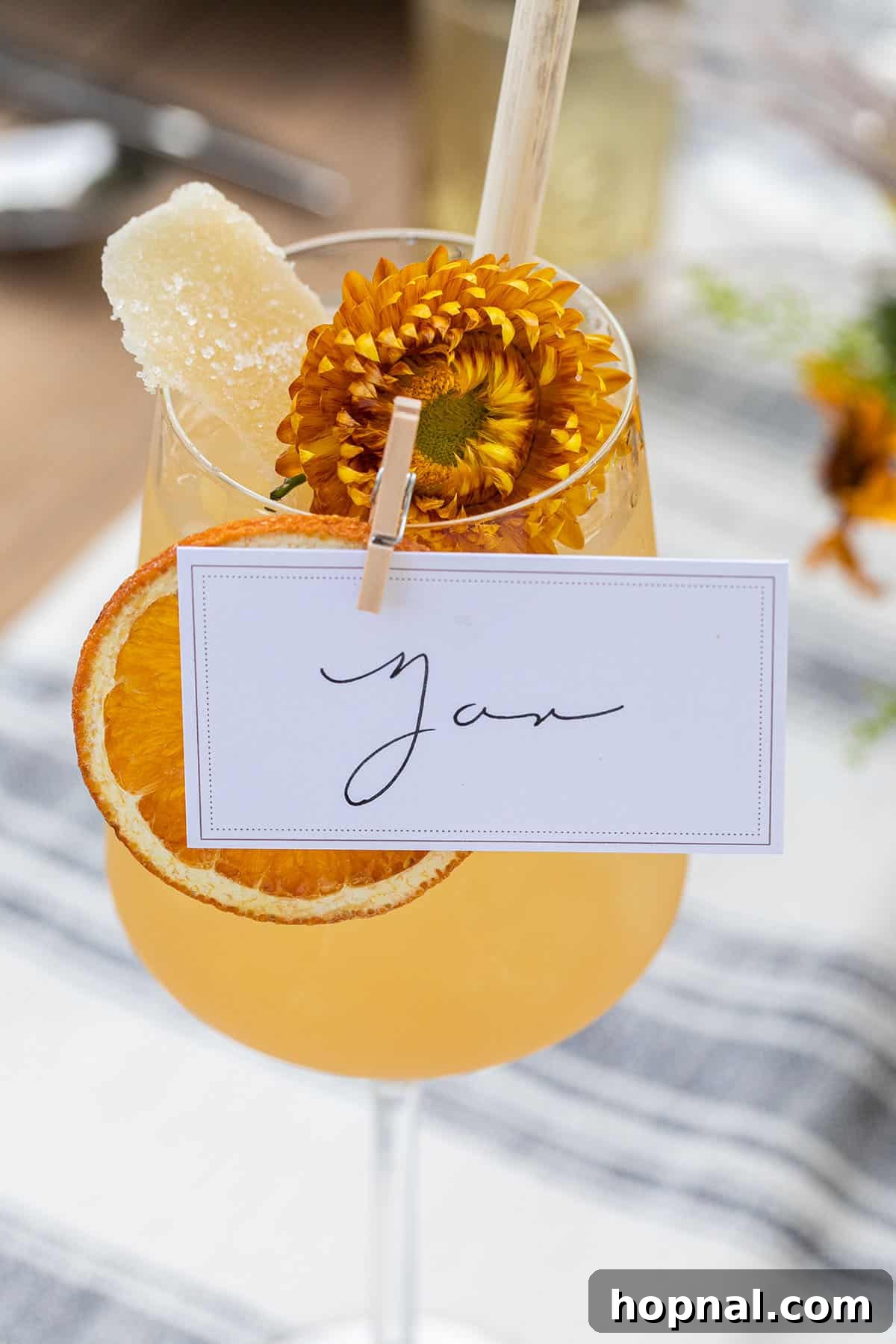 Large apple cider punch served at a fall harvest party in a rustic setting
