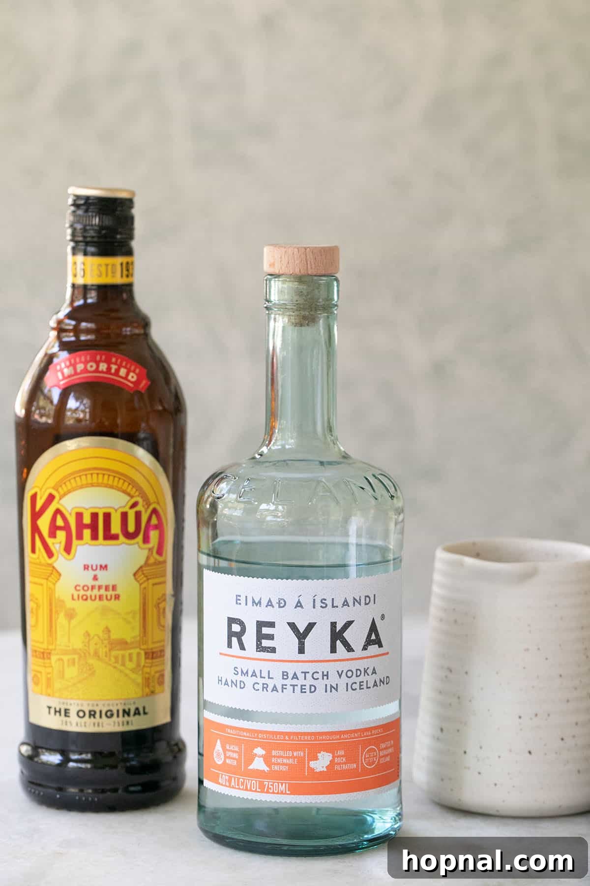 Cloud White Russian 3 Ingredients laid out for a White Russian cocktail, including vodka, coffee liqueur, and cream