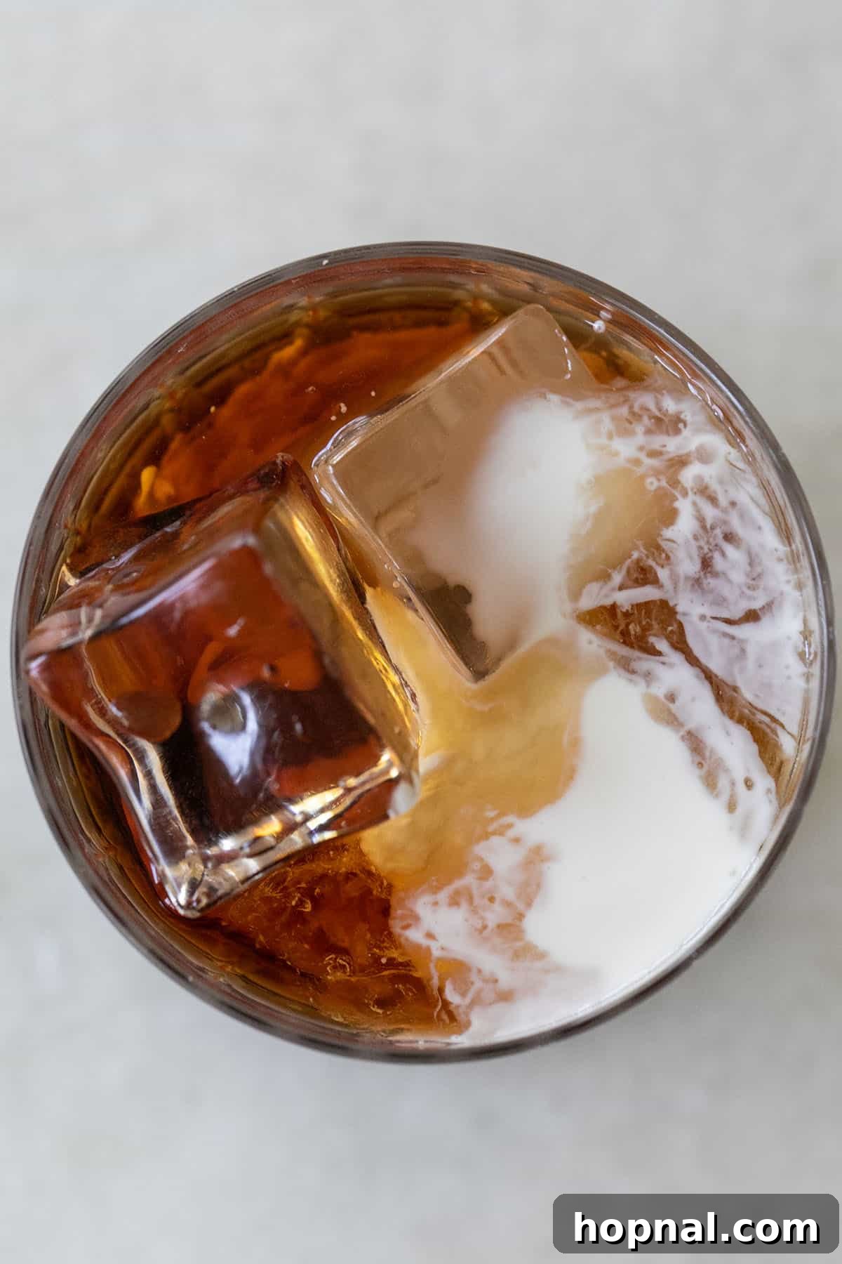 Cloud White Russian 6 A finished White Russian cocktail in a rocks glass with a garnish