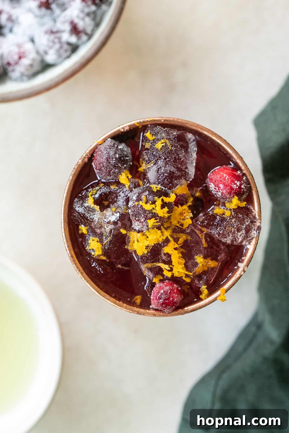 Spiced Cranberry Mule 4 orange zest and sugared cranberries over ice. - cranberry juice