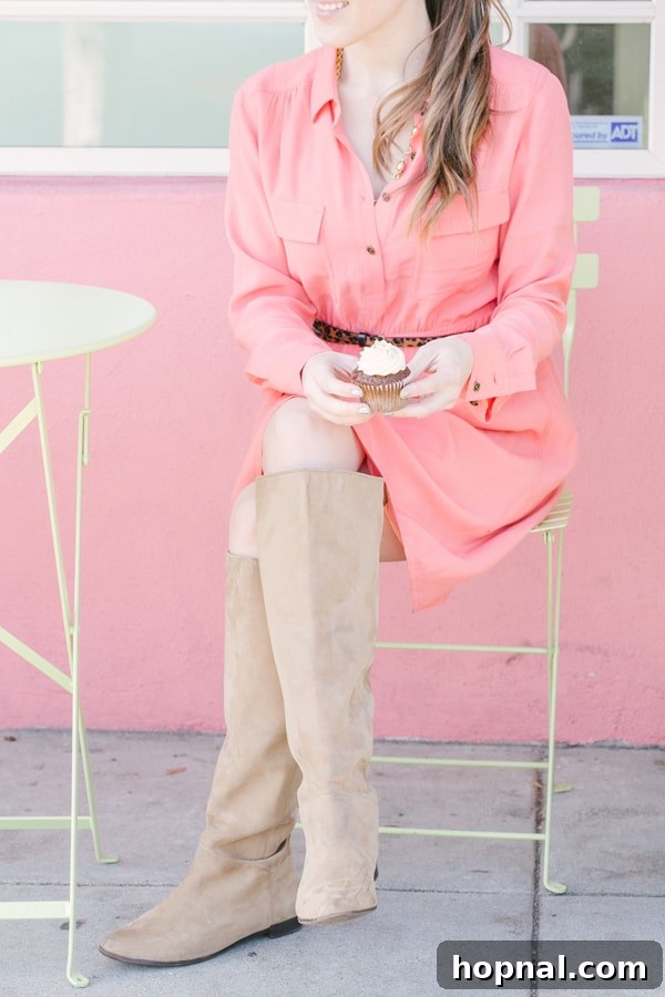 Eden Passante enjoying a delicious cupcake outside Miette, with the charming San Francisco streetscape in the background.