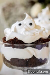 Finished ghost chocolate trifle with candy eyes on whipped cream