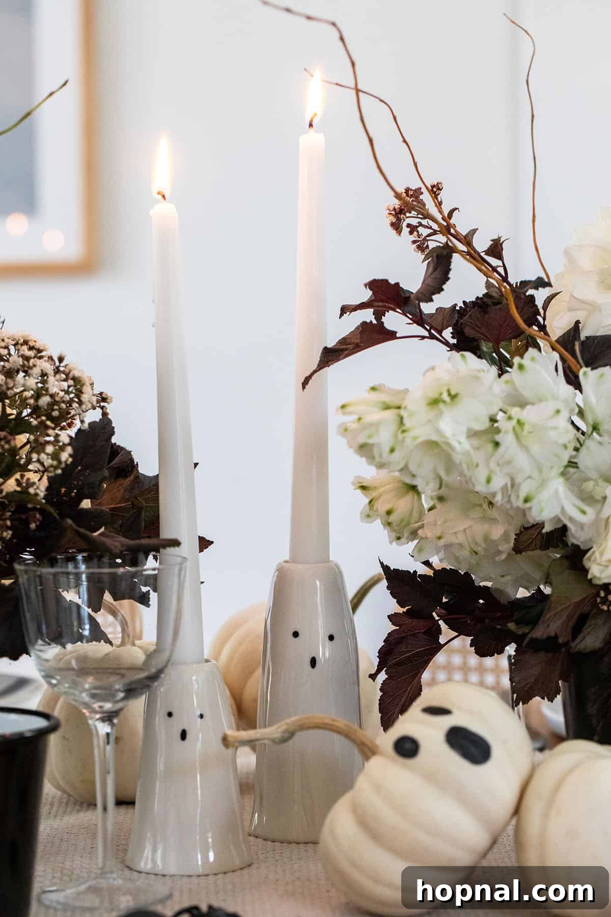 A beautifully decorated Halloween dinner party setting.