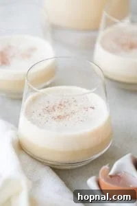 A glass of homemade eggnog ready to be enjoyed.