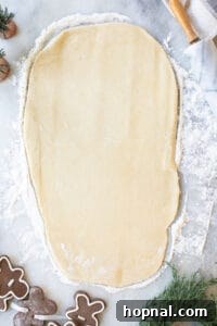 Festive Eggnog Cinnamon Buns 16 cinnamon roll dough rolled out into a rectangle