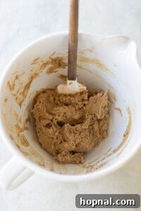 Melt-in-Your-Mouth Spritz Cookies 16 spritz cookie dough in a mixer bowl