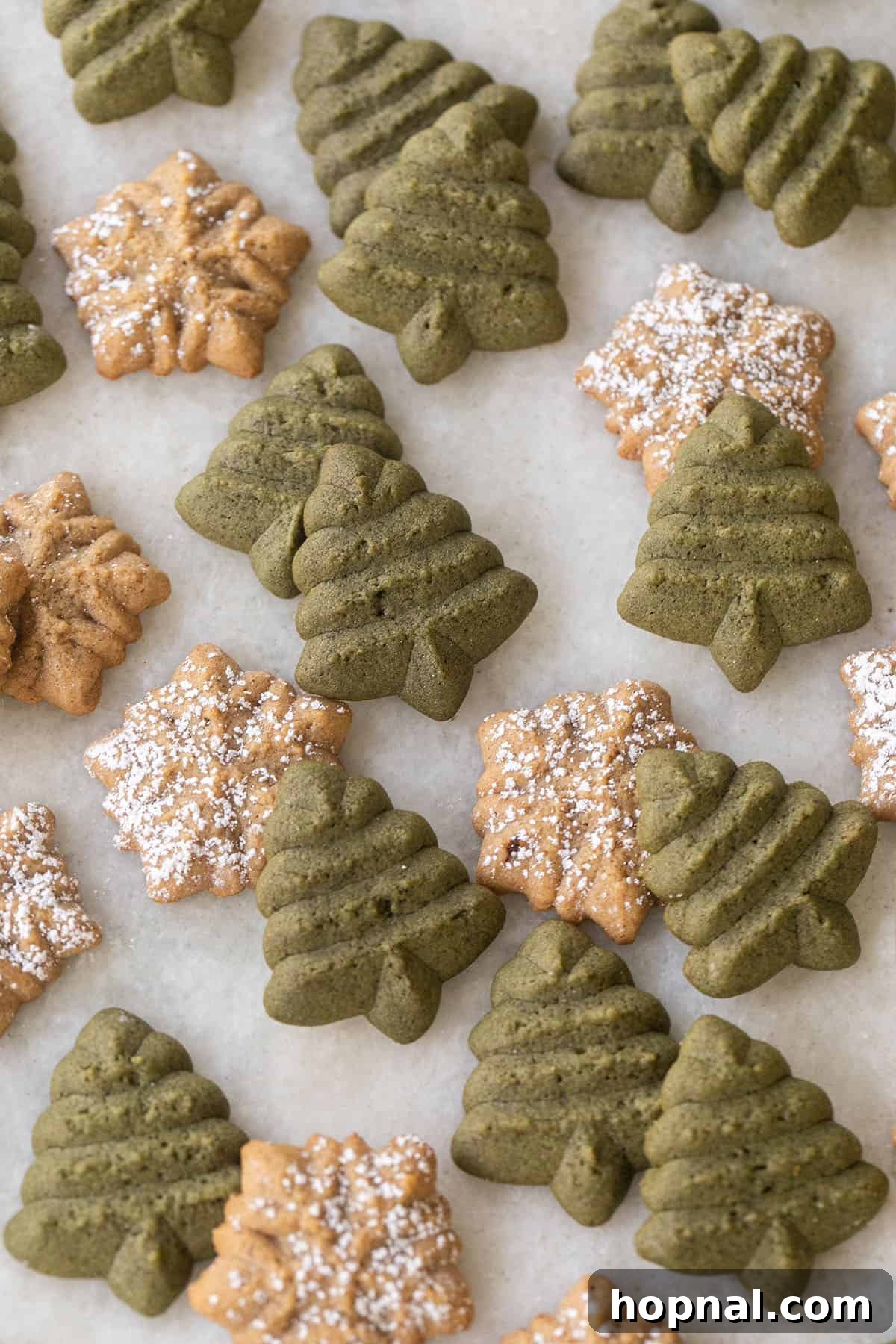 Melt-in-Your-Mouth Spritz Cookies 3 Christmas spritz cookies recipe displayed on a festive platter.