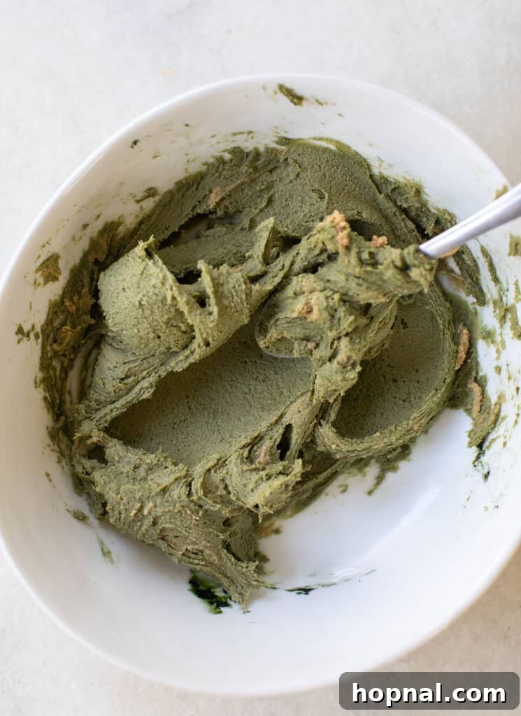 Melt-in-Your-Mouth Spritz Cookies 6 Green spritz cookie dough in a bowl, ready for the cookie press.