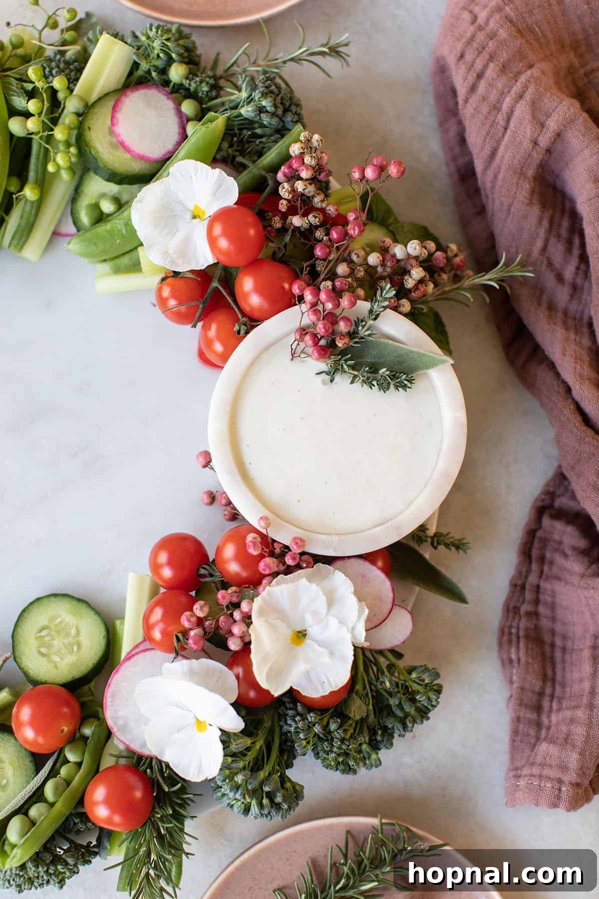 Holiday crudites platter beautifully arranged with a central dip.