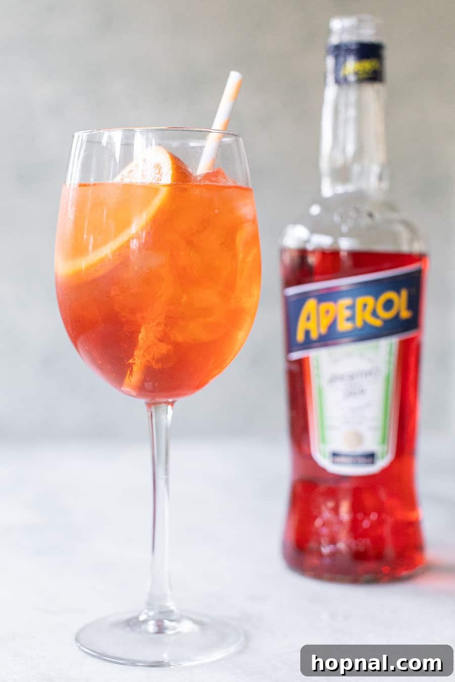 Refreshing Aperol Spritz cocktail in a wine glass with an orange slice