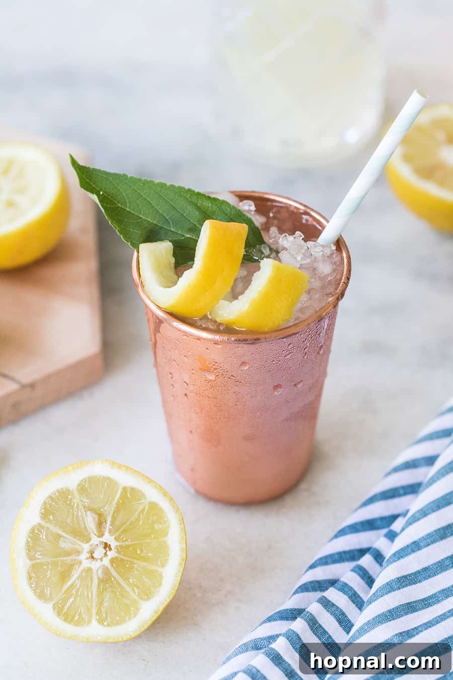 Lemon and Sage Moscow Mule served in modern copper tumblers