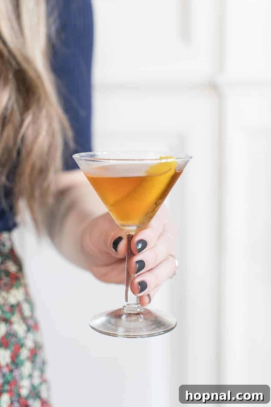 Elegant Benedictine Cocktail served in a coupe glass with a lemon twist