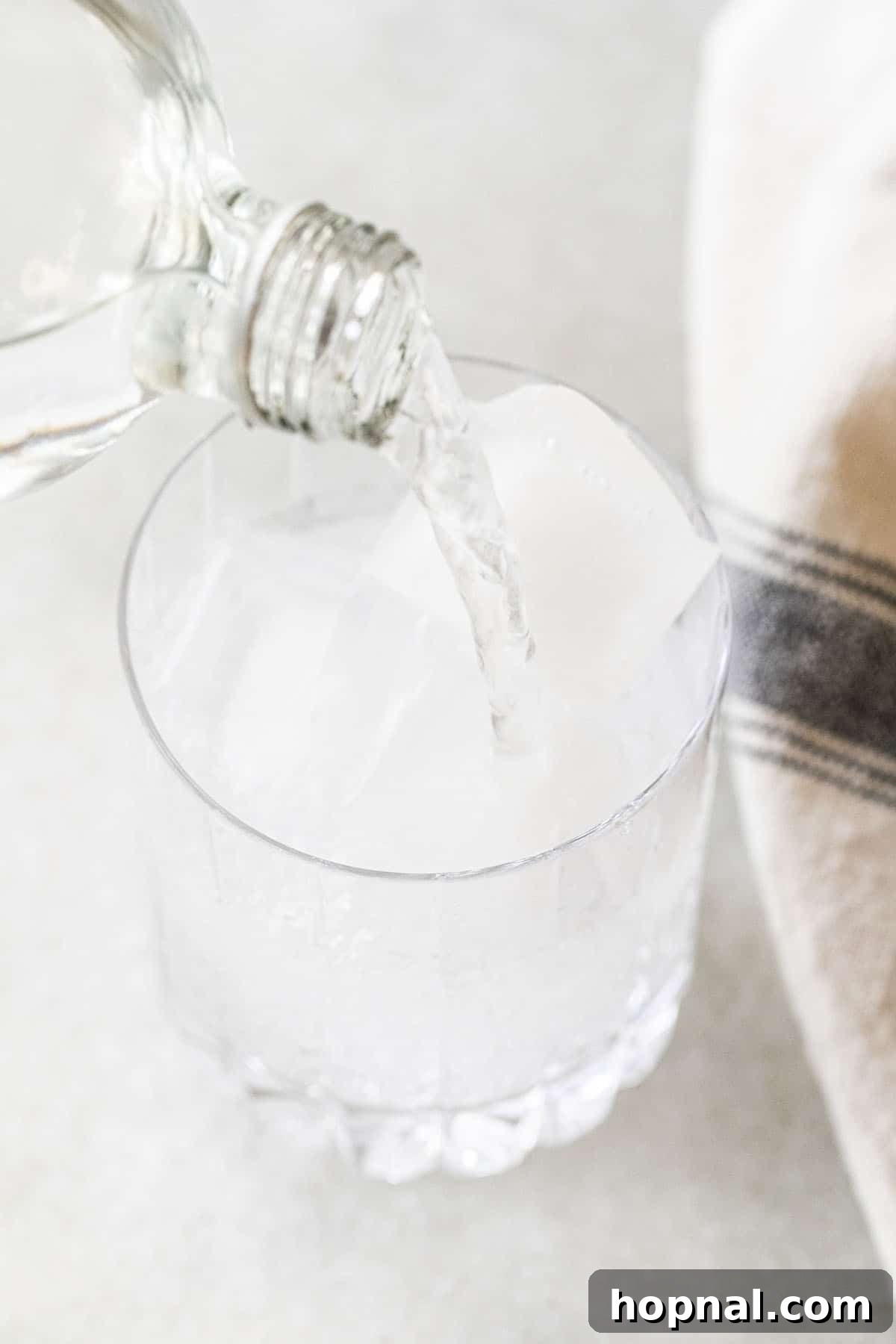 club soda pouring into a glass