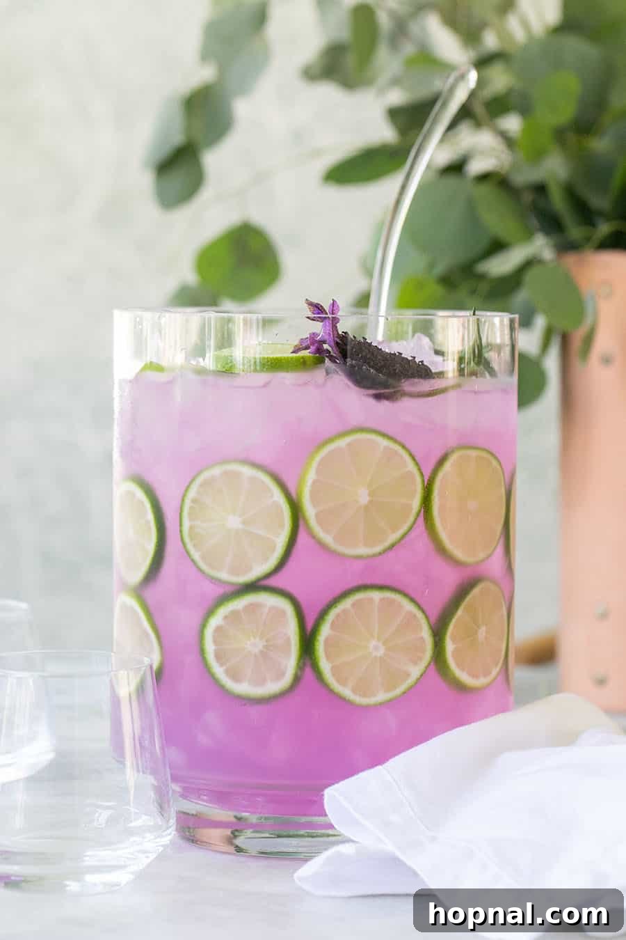 A visually appealing purple cocktail punch, perfect for sharing, made with Empress Gin.