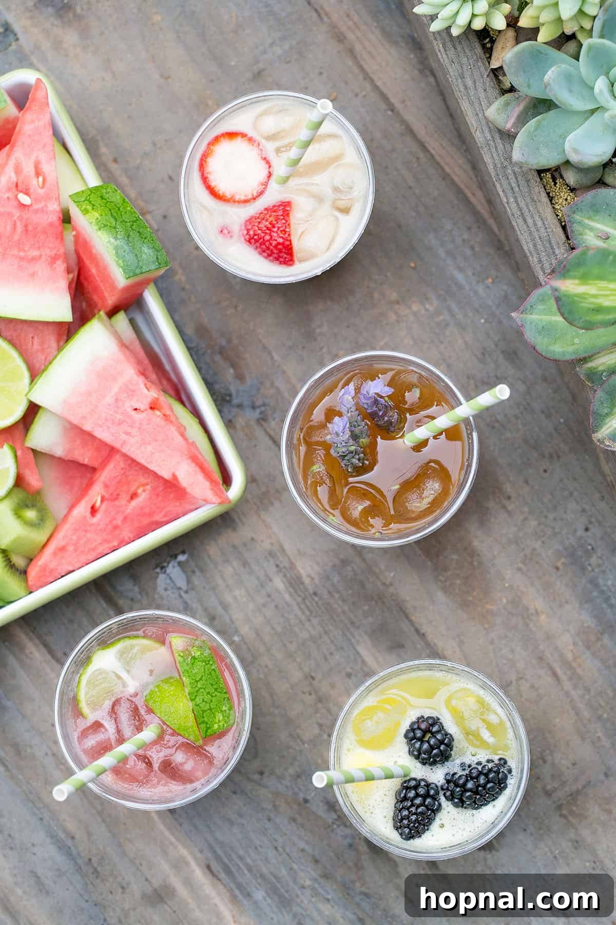 The best agua fresca recipes: a pitcher of vibrant, fresh Agua Fresca garnished with fruit slices.