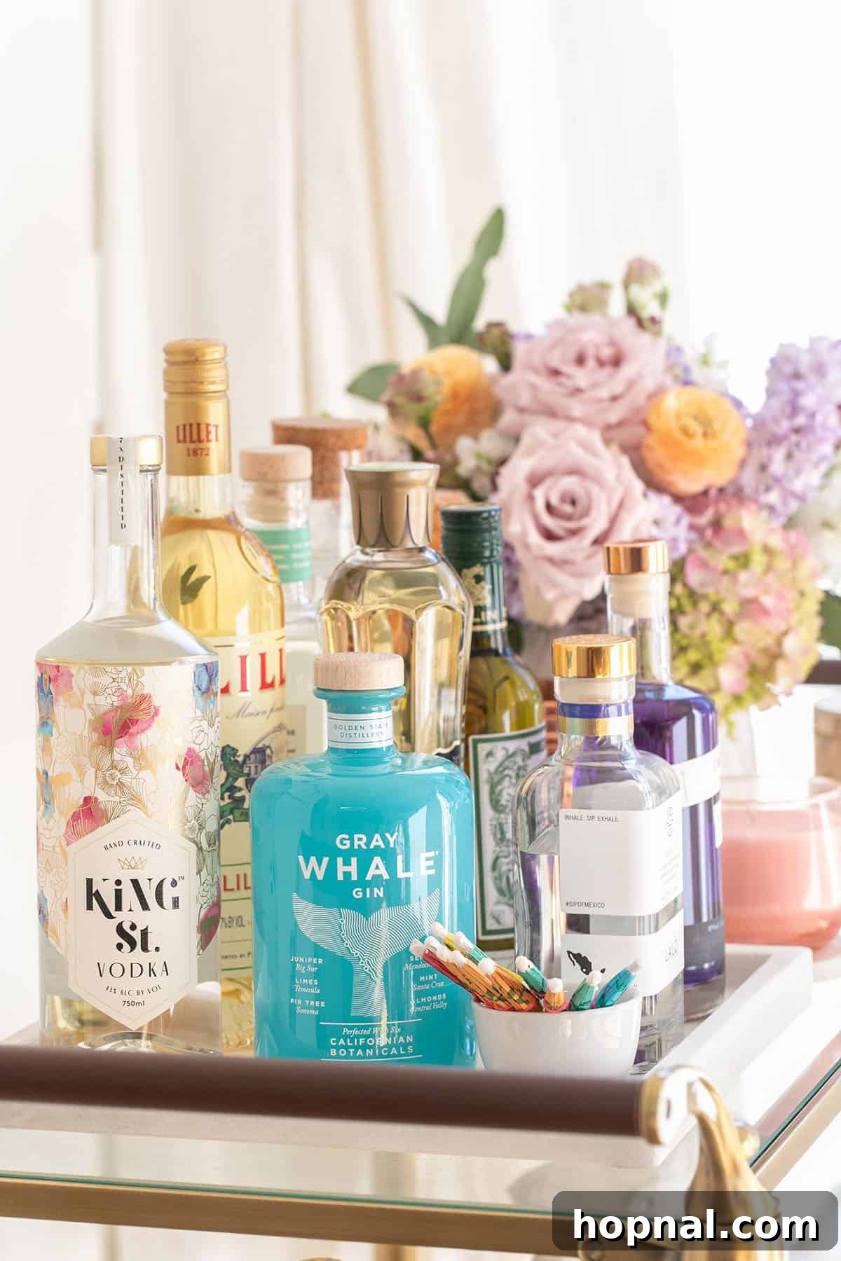 The Art of Spring Bar Styling 3 Collection of spring spirits on a stylish bar cart