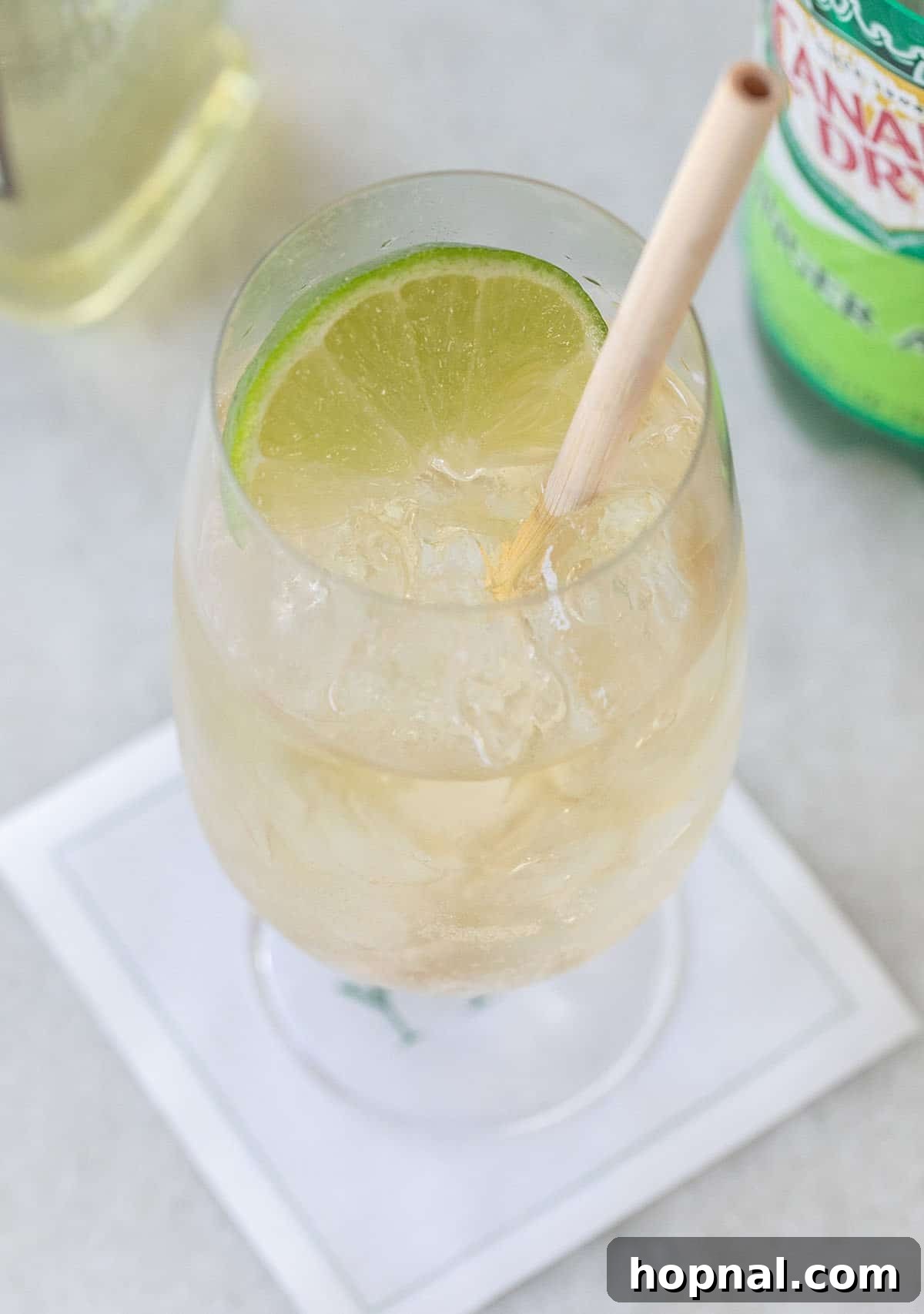 Whiskey Ginger Sparkle 4 Close-up shot of a refreshing whiskey ginger cocktail with lime garnish