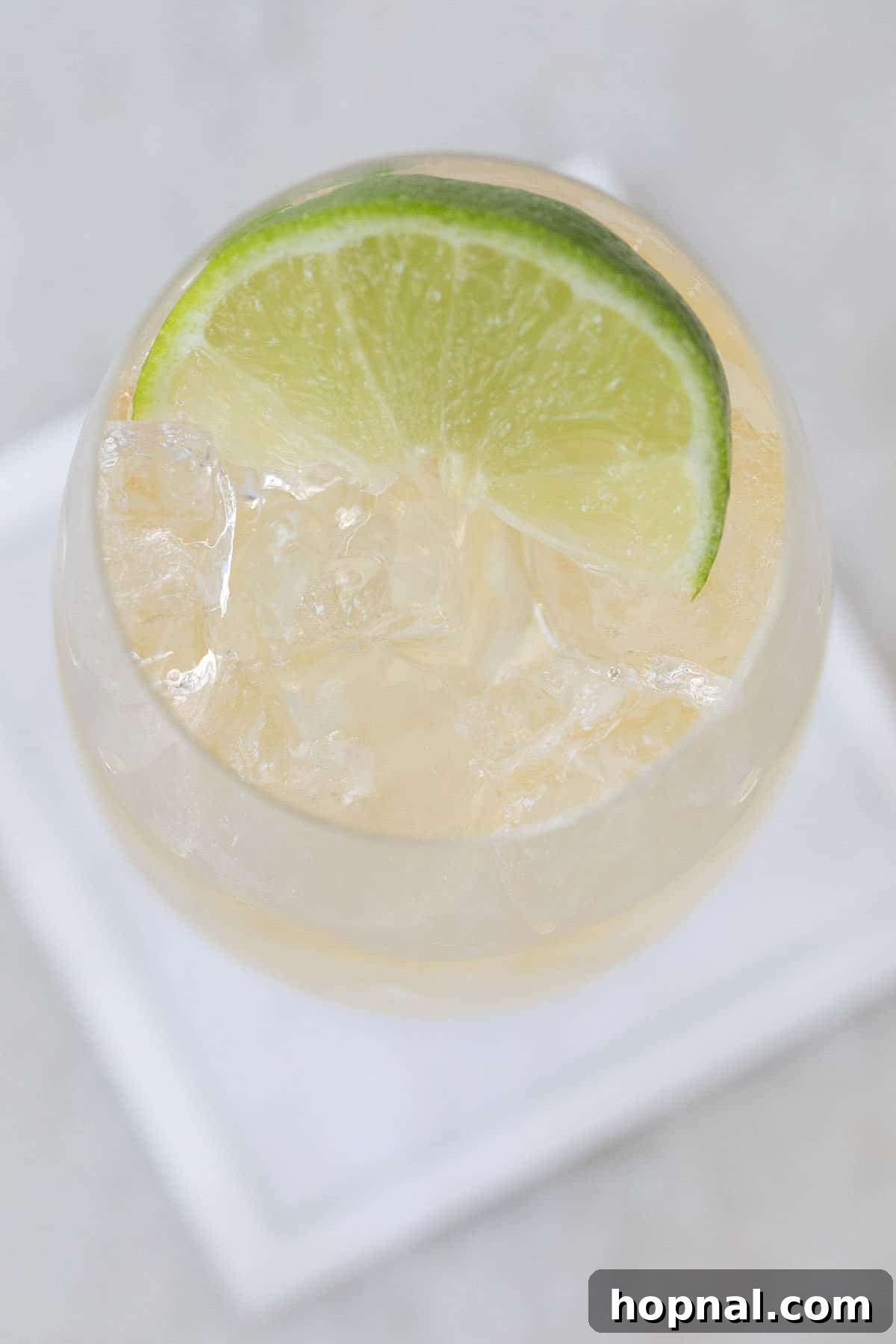 Whiskey Ginger Sparkle 5 Step-by-step image showing how to make a whiskey ginger ale cocktail