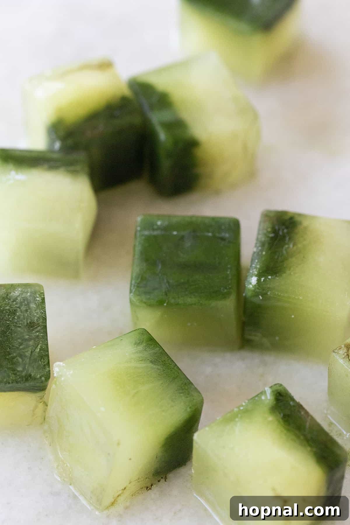 Matcha Spritz: Your Cool Green Escape 5 Matcha ice cubes chilling a glass, ready for a matcha spritz.