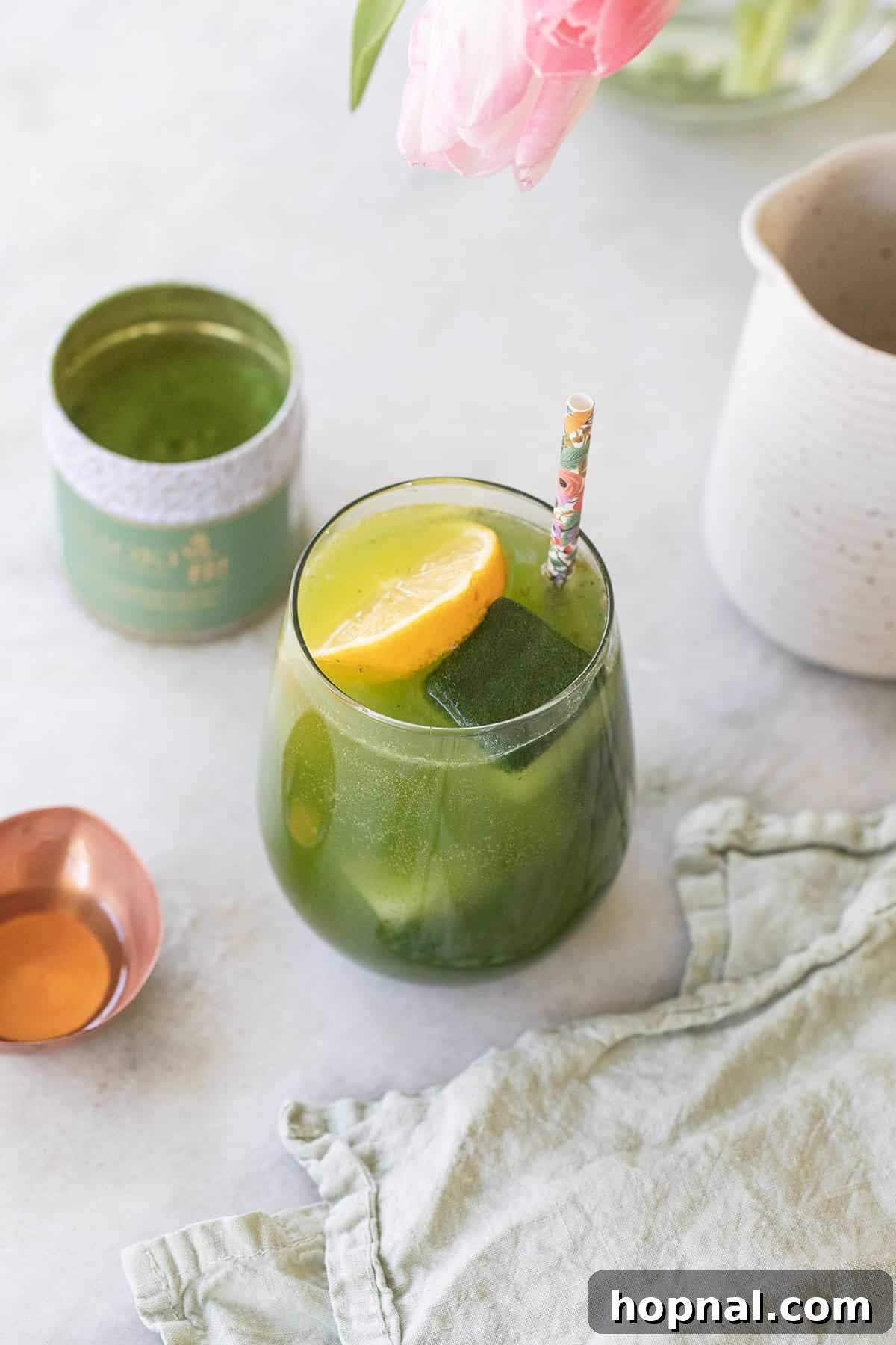 Matcha Spritz: Your Cool Green Escape 7 Close-up of a refreshing matcha spritz garnished with lemon slices, ready to be enjoyed.