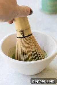 whisking matcha powder