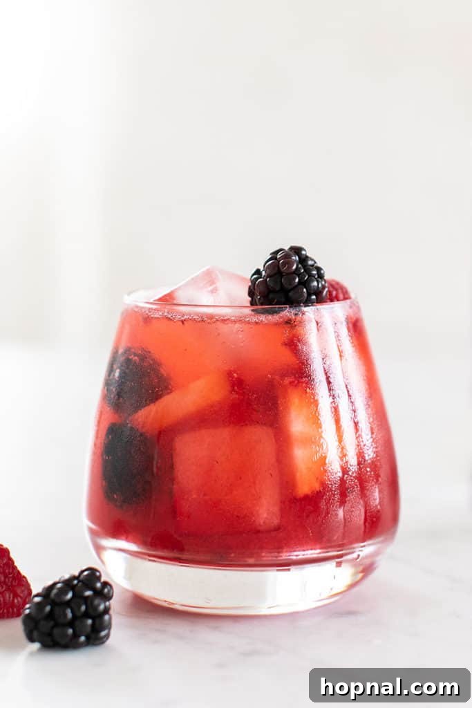 Vibrant wild berry 4th of July cocktail, bursting with fruity flavors
