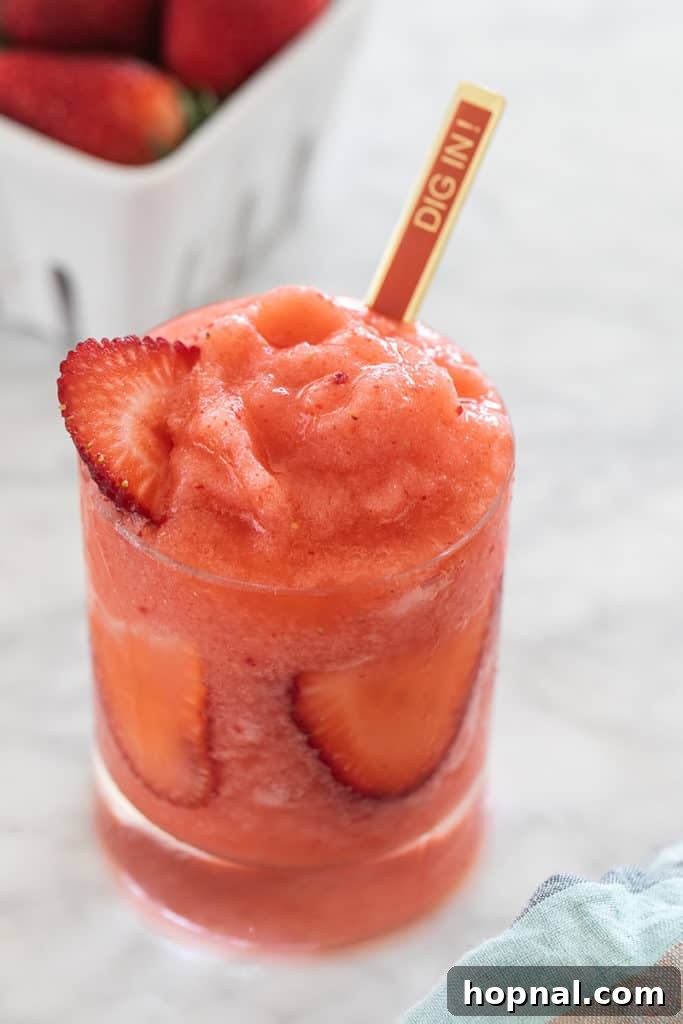 Vibrant frozen lemonade cocktail with a patriotic garnish for the 4th of July