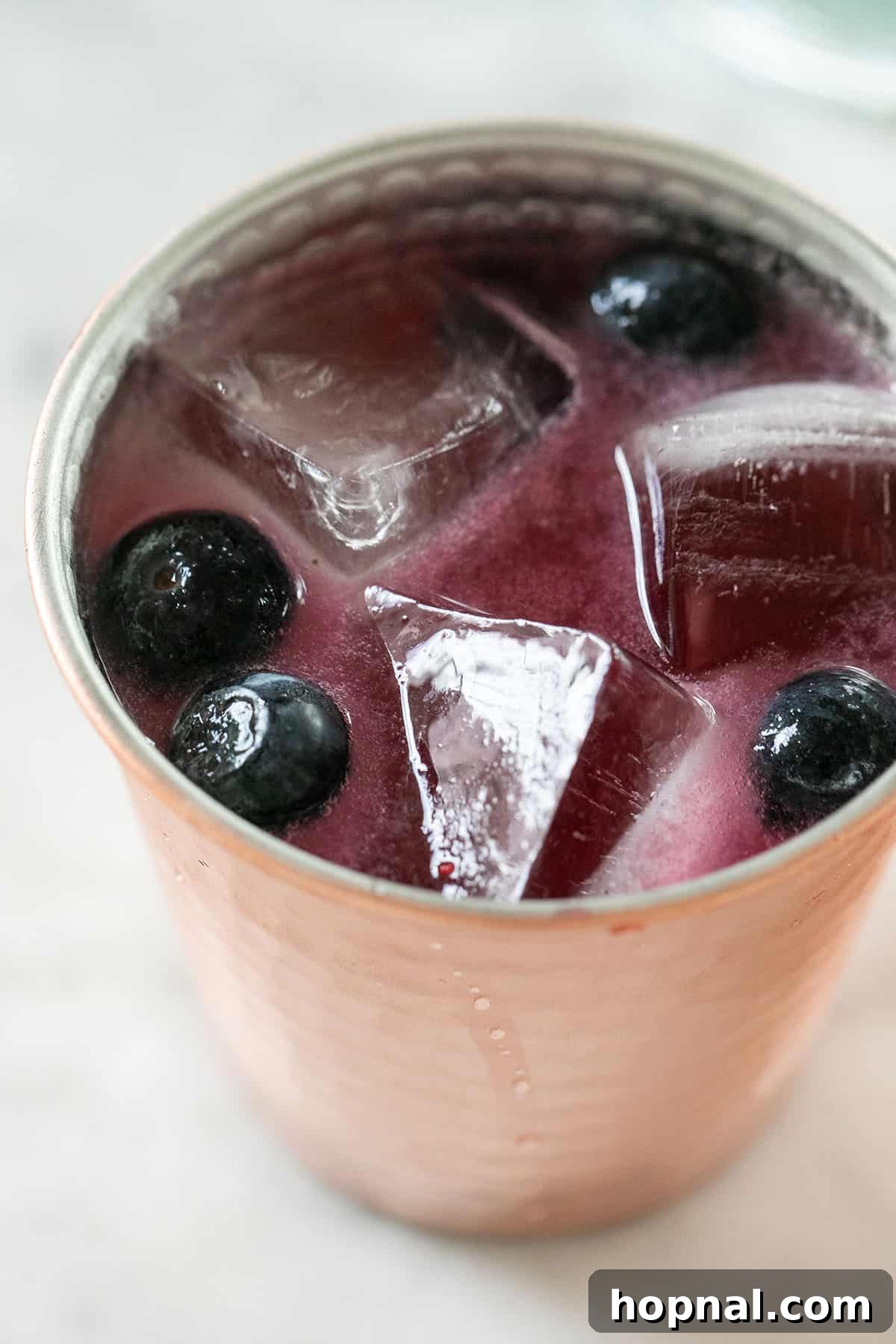 Vibrant Blueberry Moscow Mule recipe, a fruity and fizzy drink