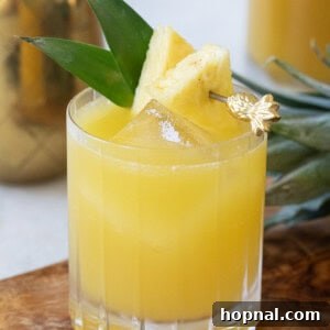 Tropical Pineapple Vodka Elixir 9 A close-up of a vibrant pineapple vodka cocktail, ready to be enjoyed.