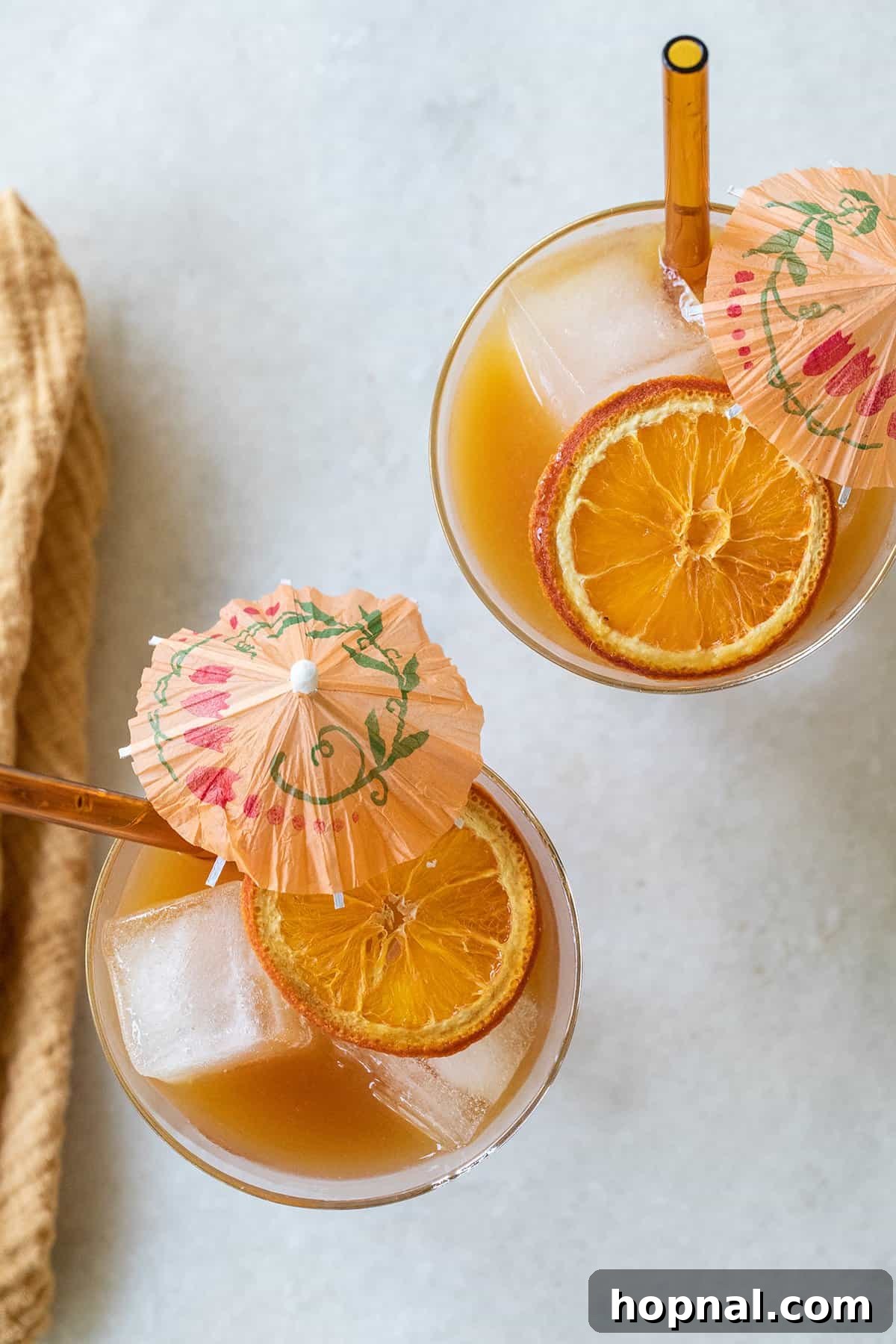Two Brass Monkey cocktails, served in elegant glasses, highlighting their inviting orange hue.