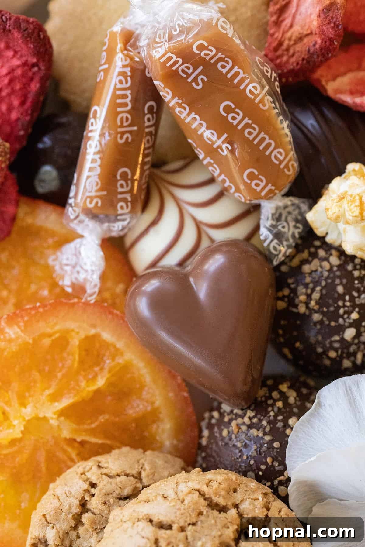 Sweet Grazing Board 7 An inviting charcuterie platter featuring exquisite chocolate truffles and rich caramels, designed for a luxurious dessert experience.