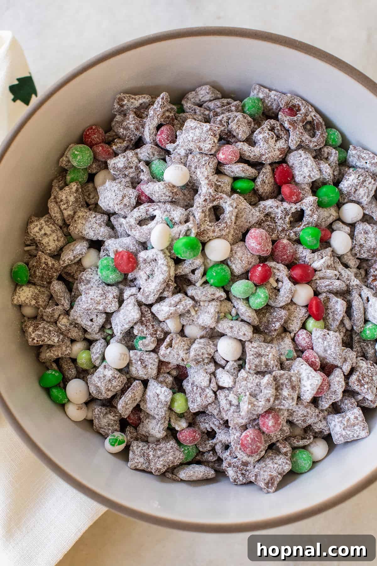 Magic Reindeer Dust 2 A festive bowl of homemade Christmas Reindeer Food adorned with red and green M&Ms and sprinkles, a perfect holiday treat for family gatherings.