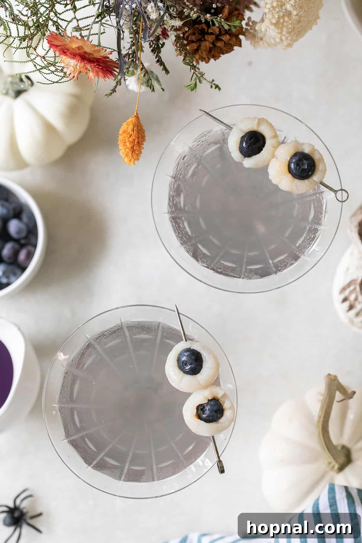 Two Lychee cocktail with lychee cocktail garnish.