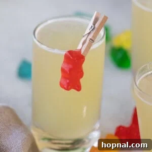 Tipsy Teddy Shot 9 A perfectly prepared white Gummy Bear Shot in a clear glass, ready to be enjoyed.