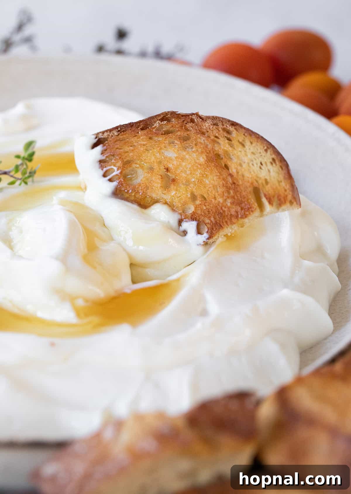 Dipping crusty bread into fluffy whipped ricotta with honey and thyme.
